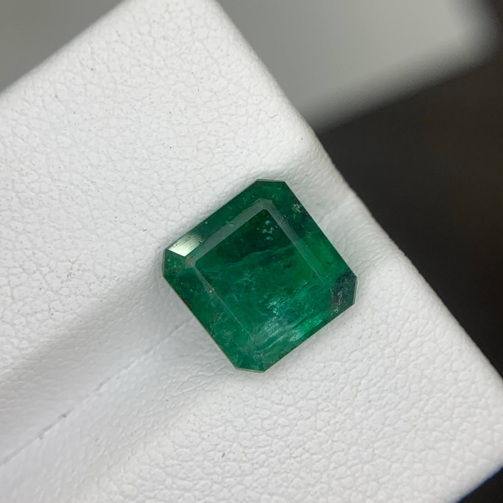 Emerald gemstone on a white background