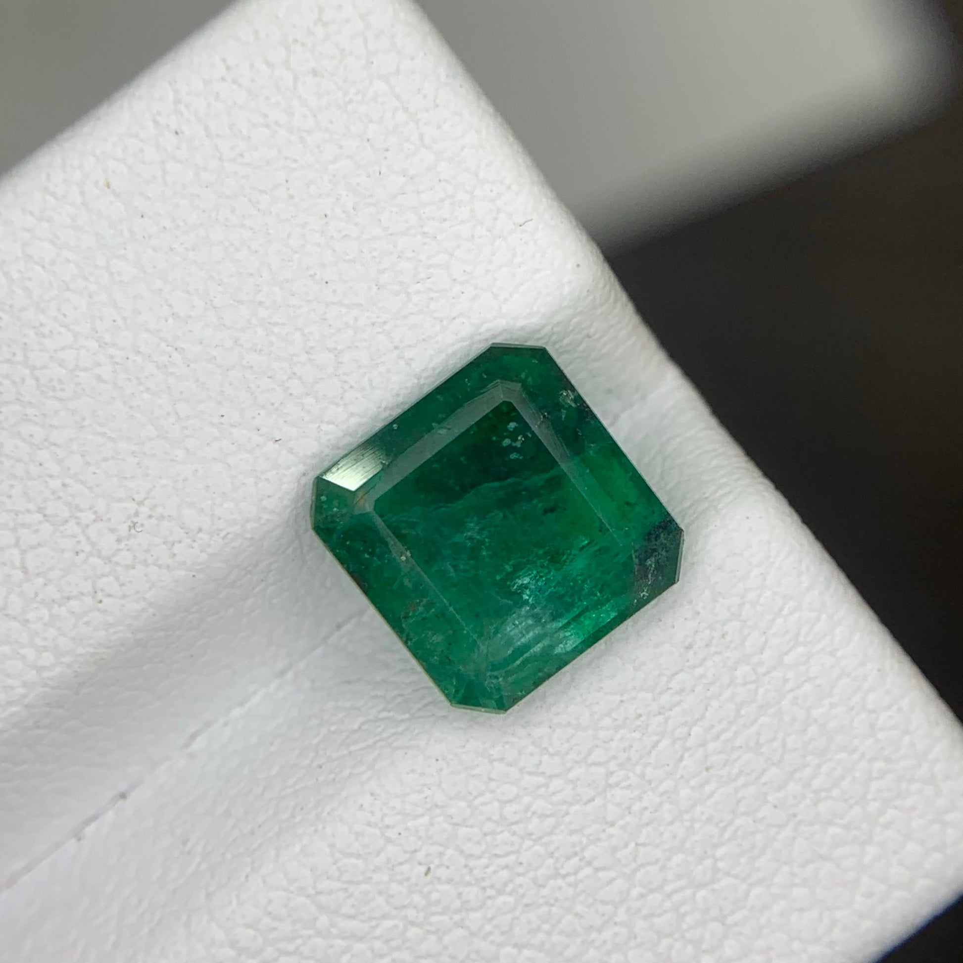 Emerald gemstone on a white background