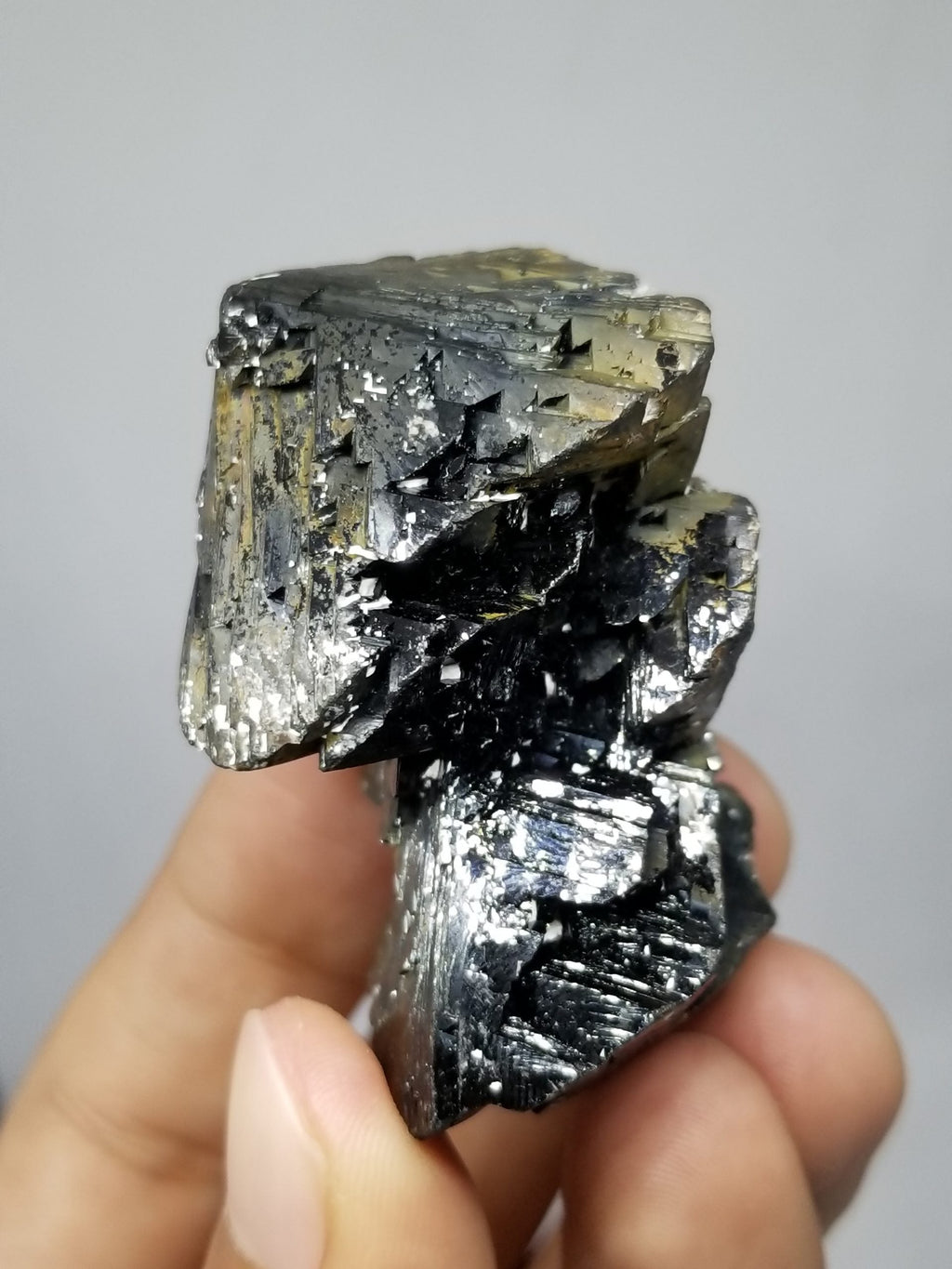 Cassiterite with nice crystal habit and shiny luster with gray background at Gandhara Fine Minerals