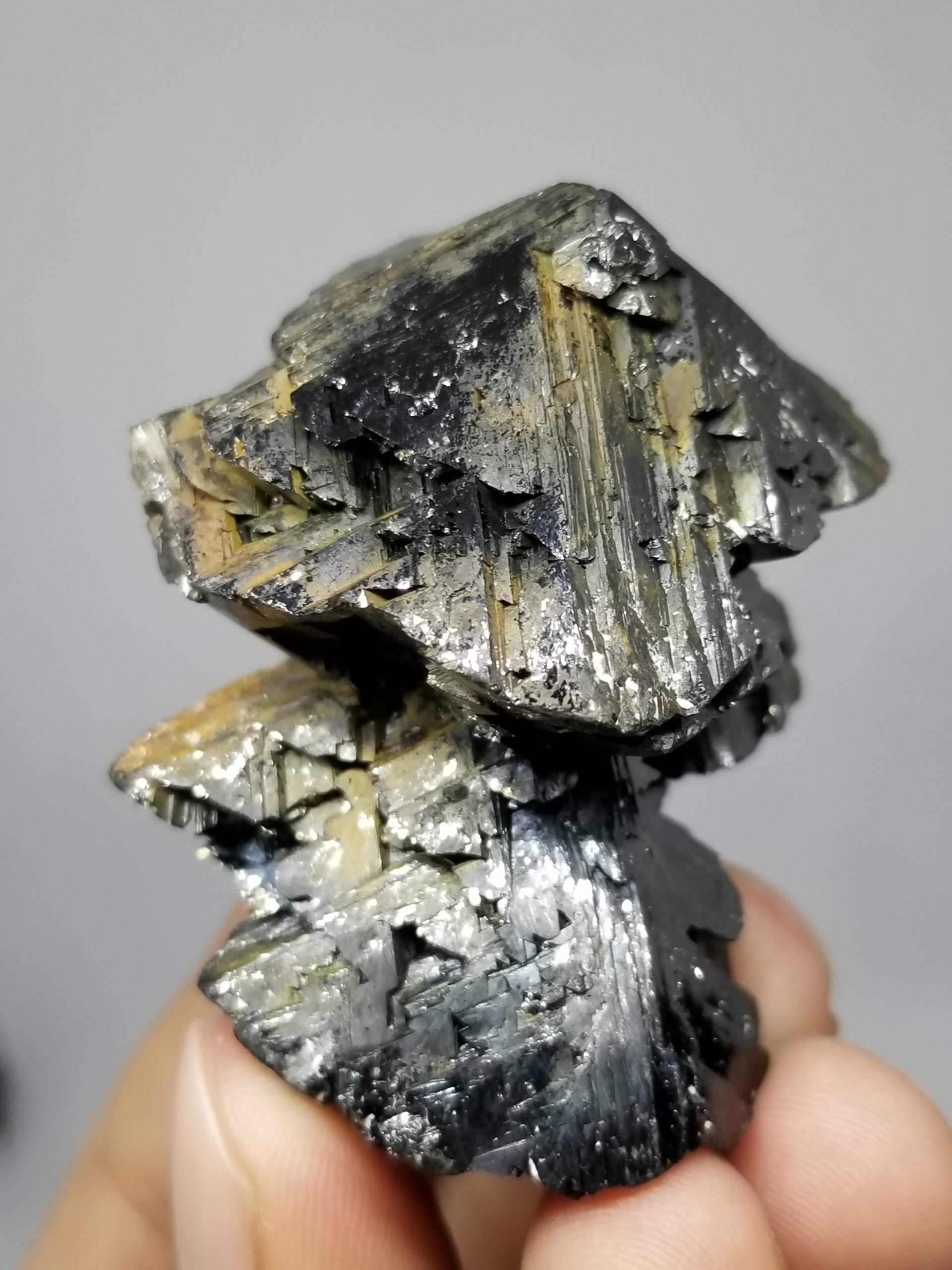 Cassiterite with nice crystal habit and shiny luster with gray background at Gandhara Fine Minerals