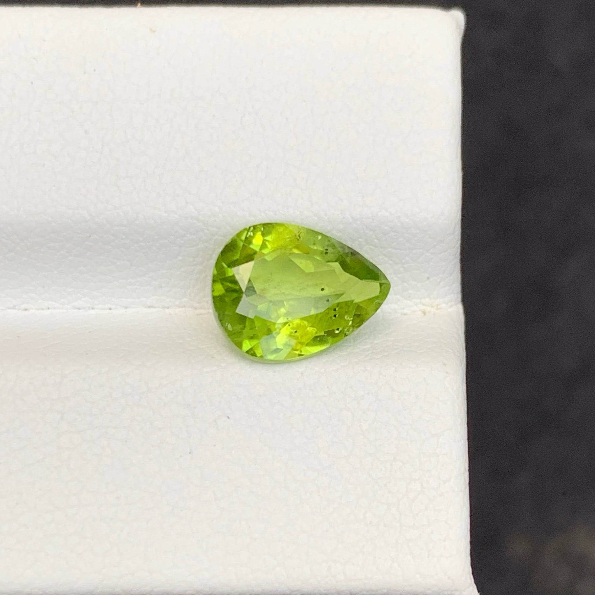 2.56 Carat Apple Green Peridot Green gemstone on a white background