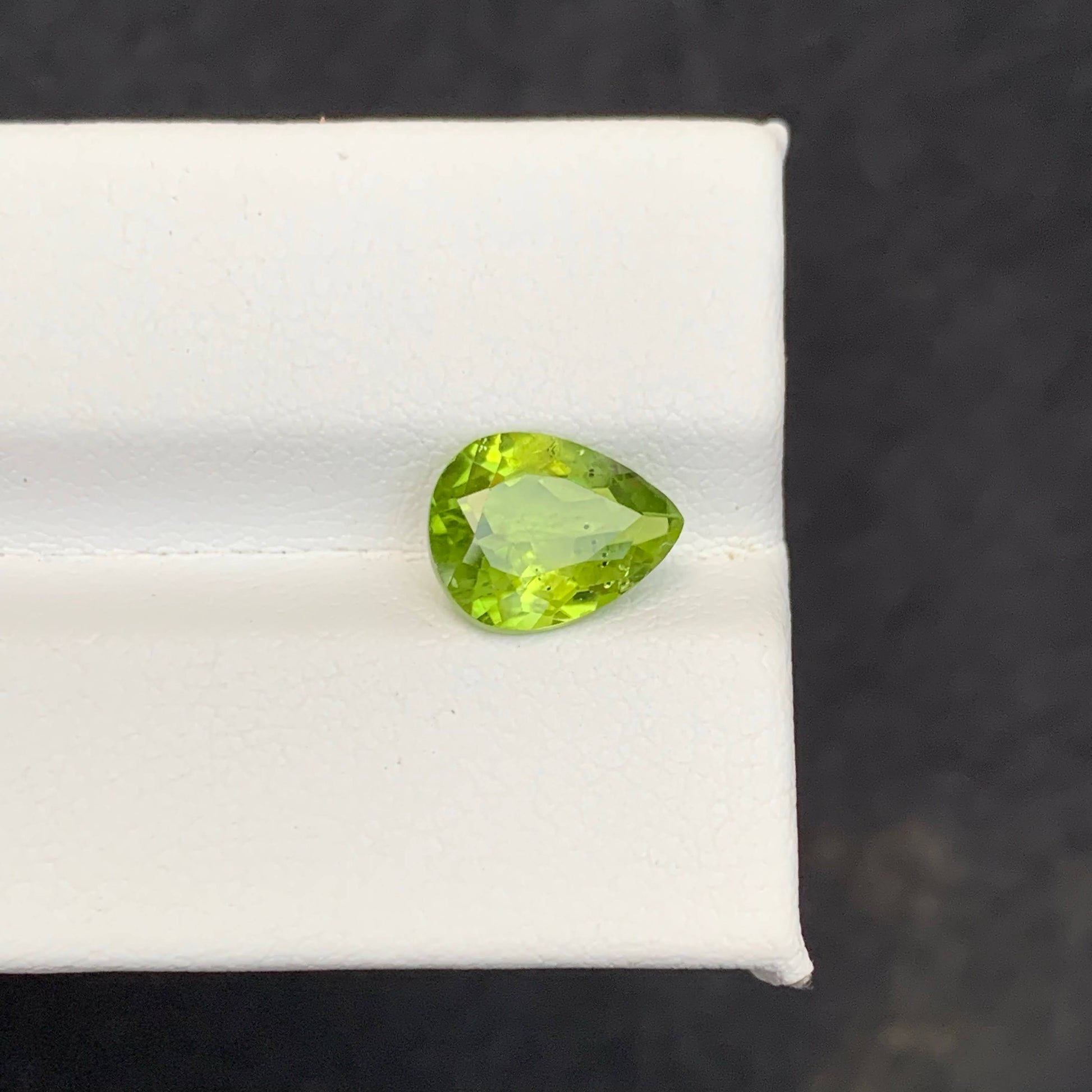 2.56 Carat Apple Green Peridot Green gemstone on a white 