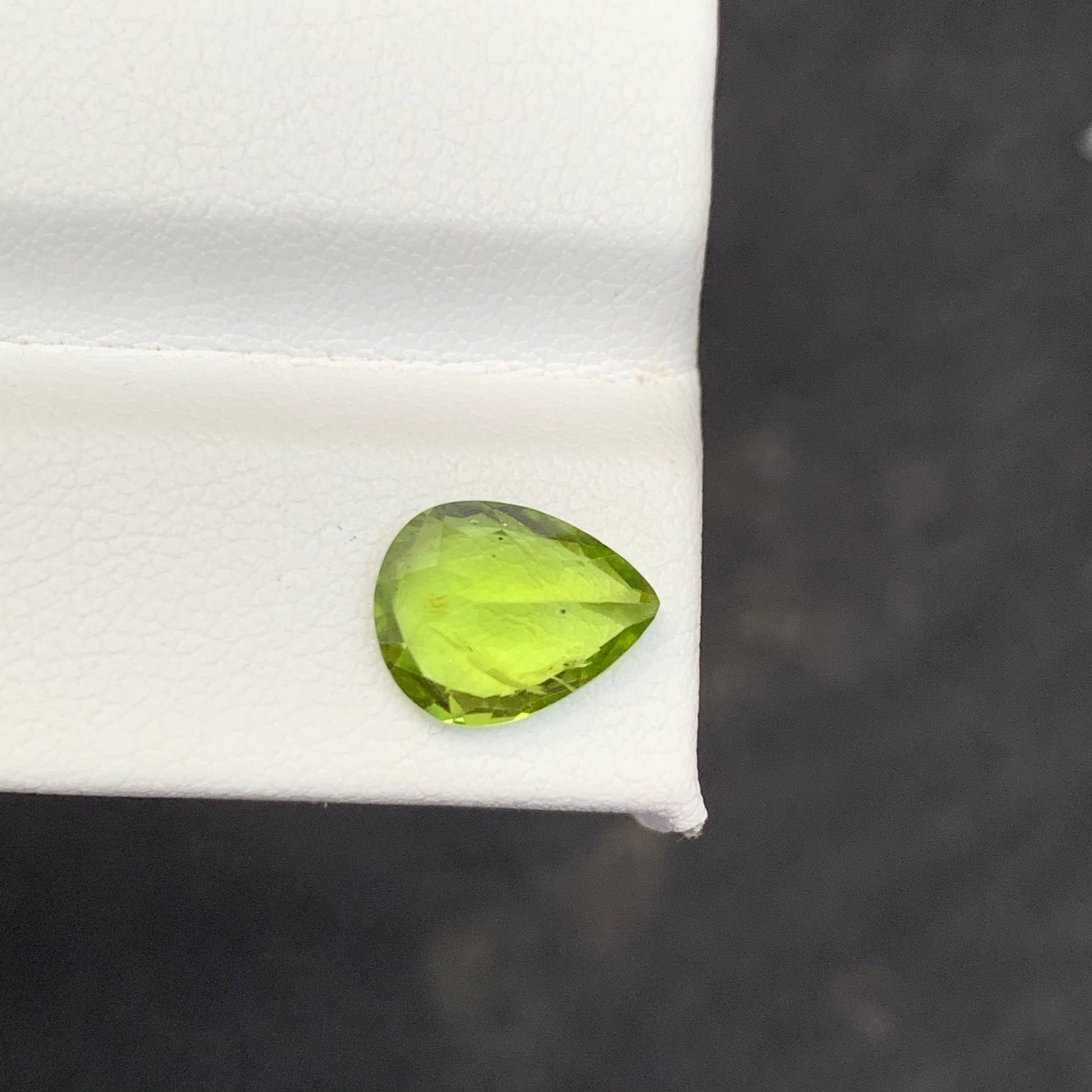 2.56 Carat Apple Green Peridot Green gemstone on a white 