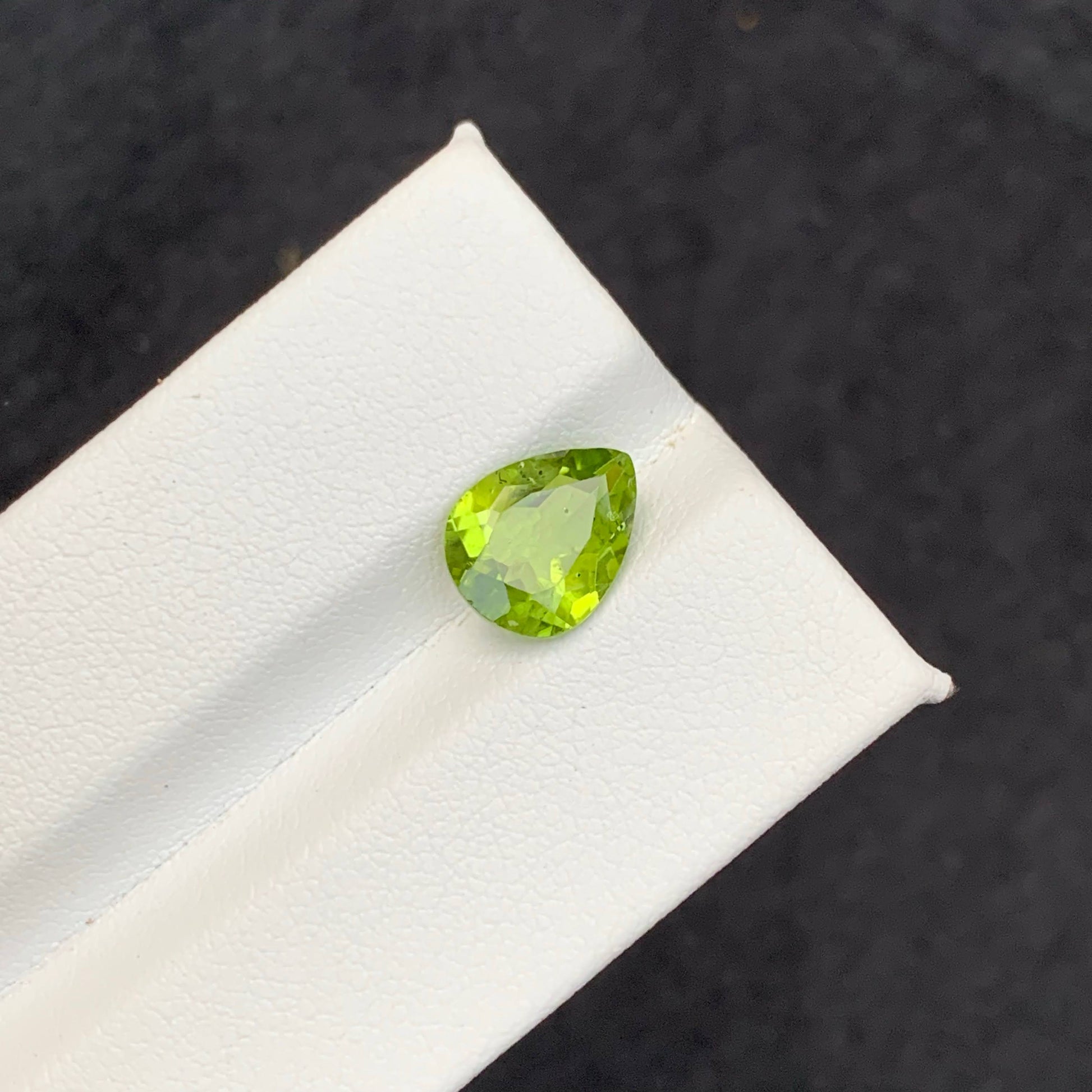 2.56 Carat Apple Green Peridot Green gemstone on a white 