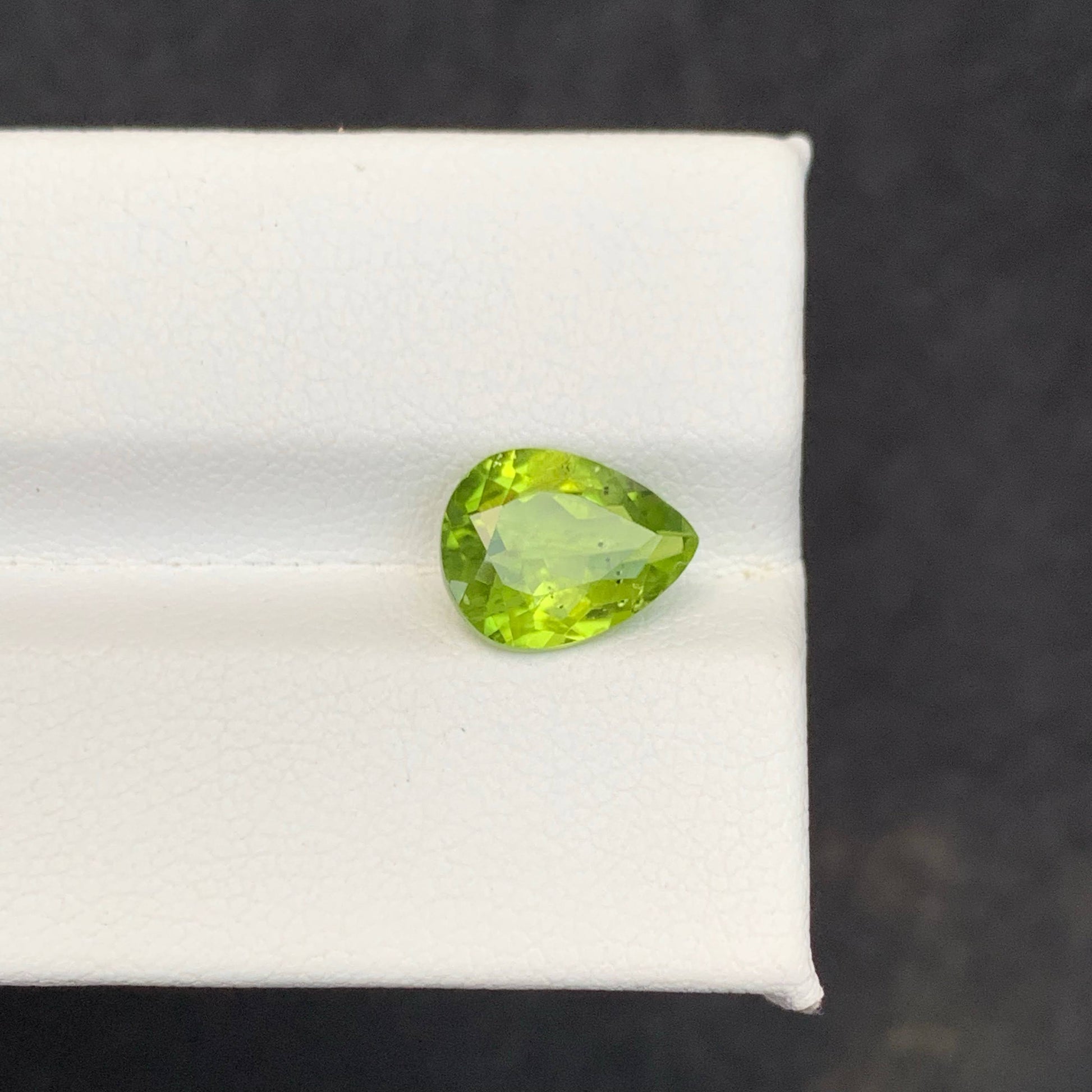 2.56 Carat Apple Green Peridot Green gemstone on a white 