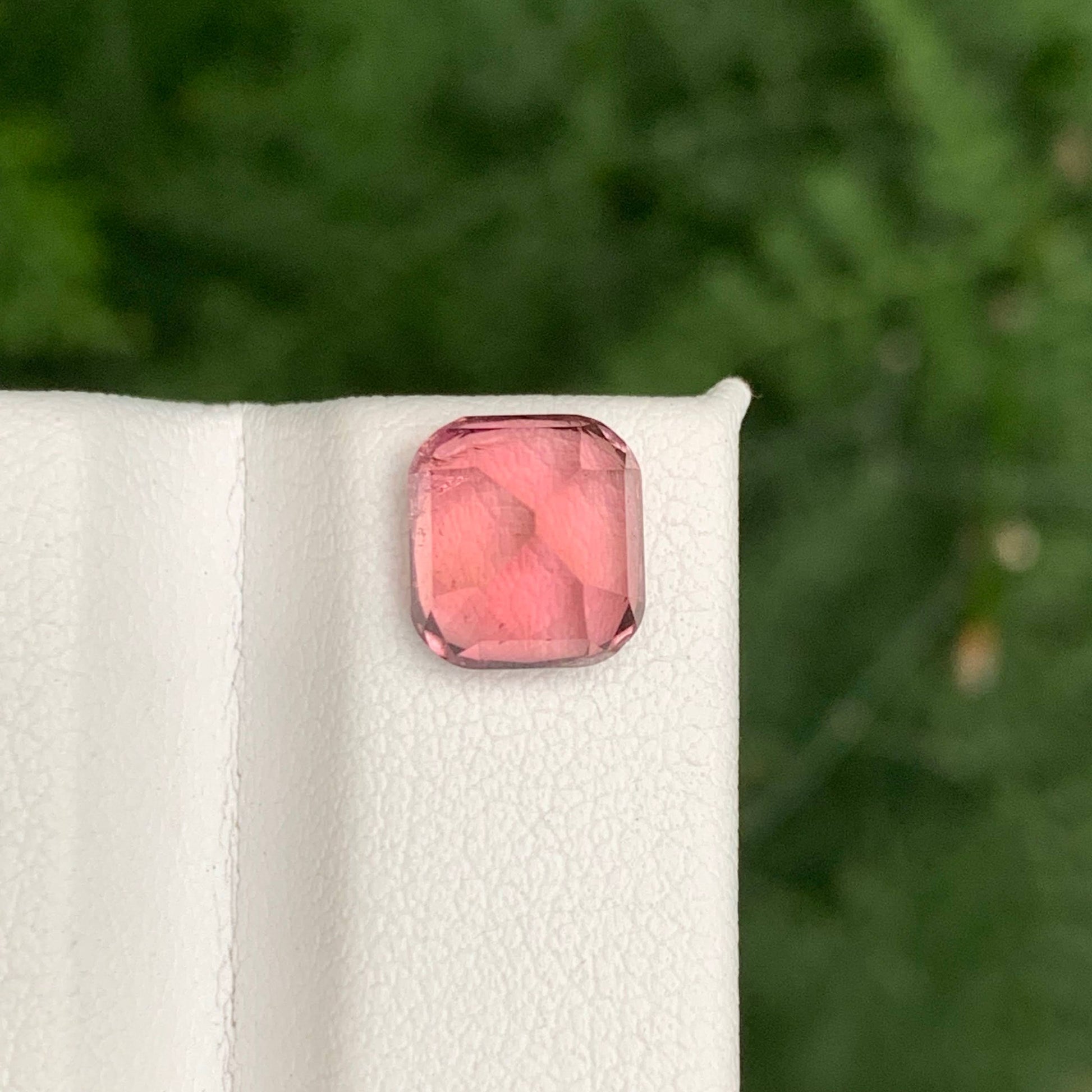 2.85 Carats Baby Pink Tourmaline
Pink gemstone on a white cloth with a blurred green background