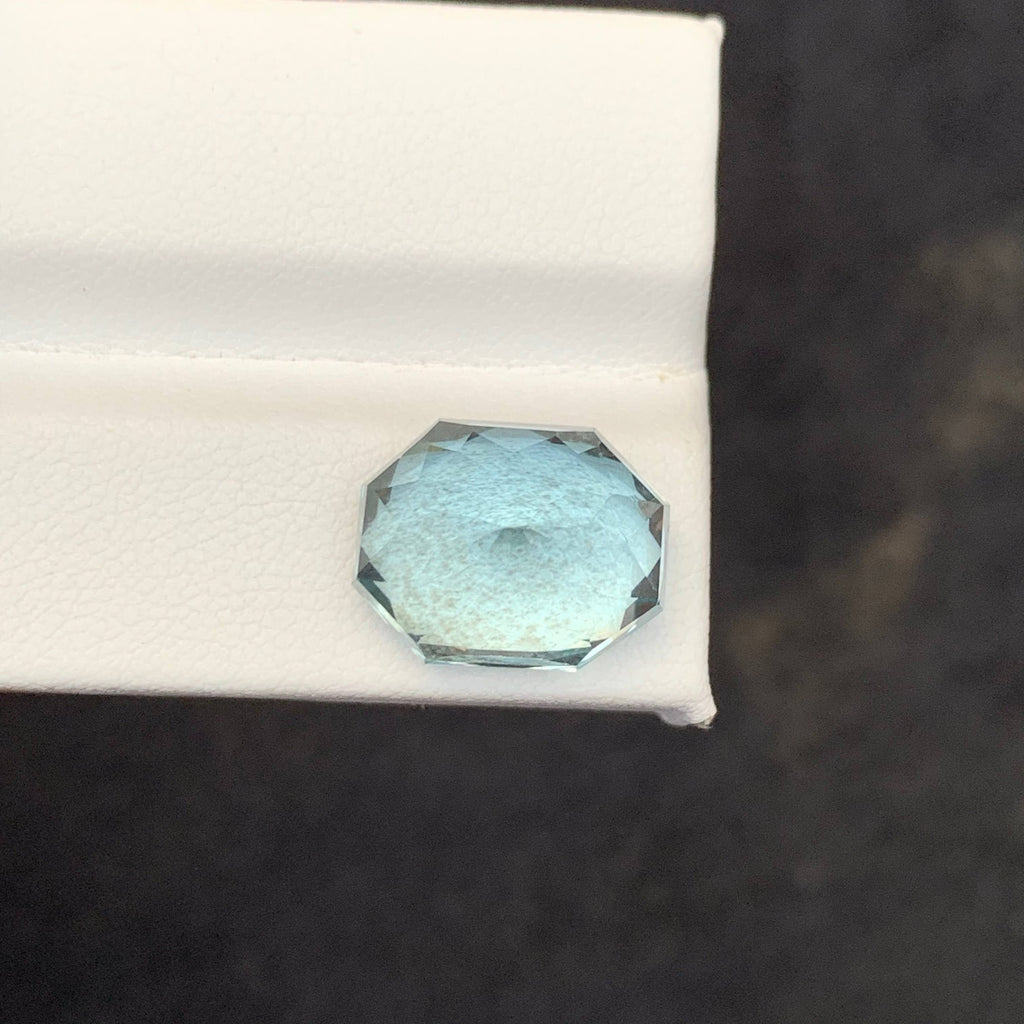 10.65 Carat Blue Aquamarine Faceted blue gemstone on a white 