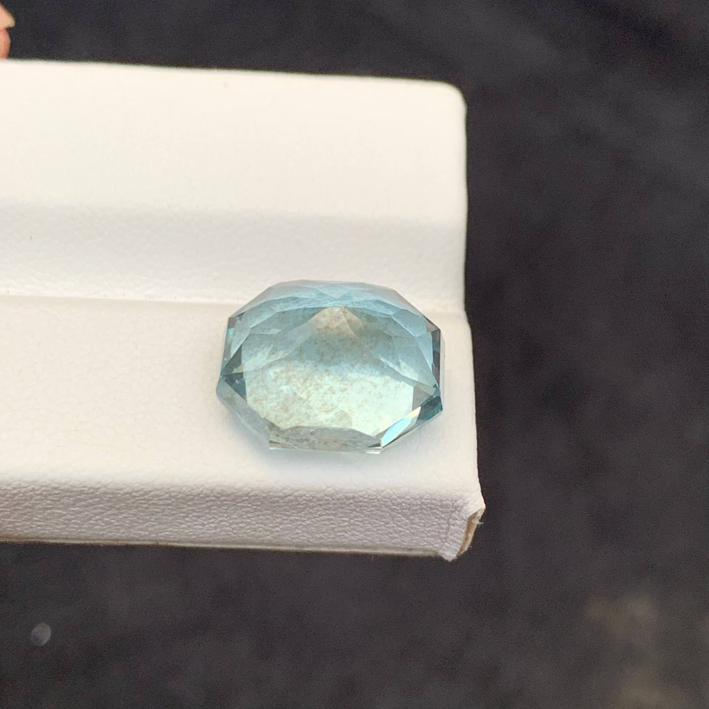 10.65 Carat Blue Aquamarine Faceted blue gemstone on a white 