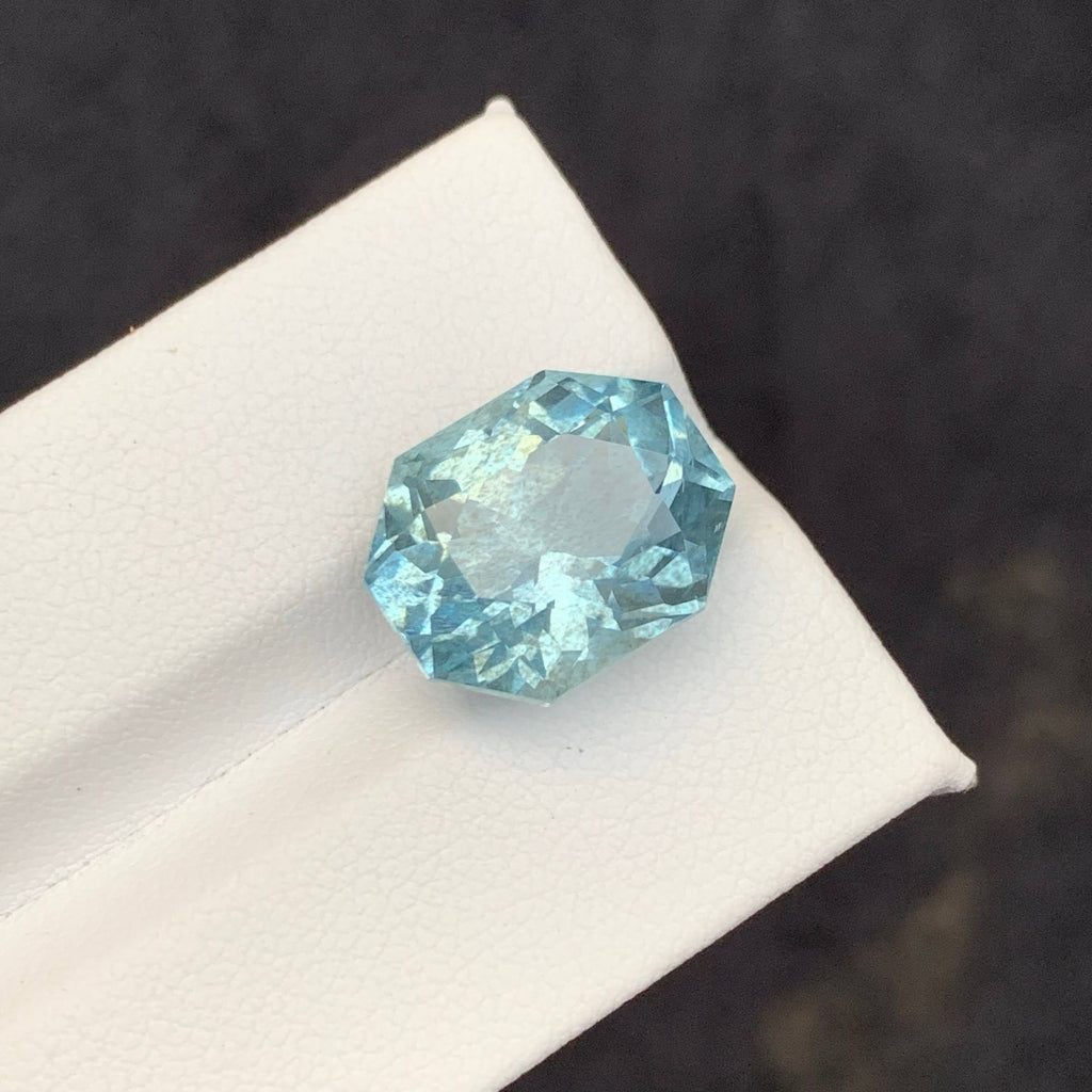 10.65 Carat Blue Aquamarine Faceted blue gemstone on a white 