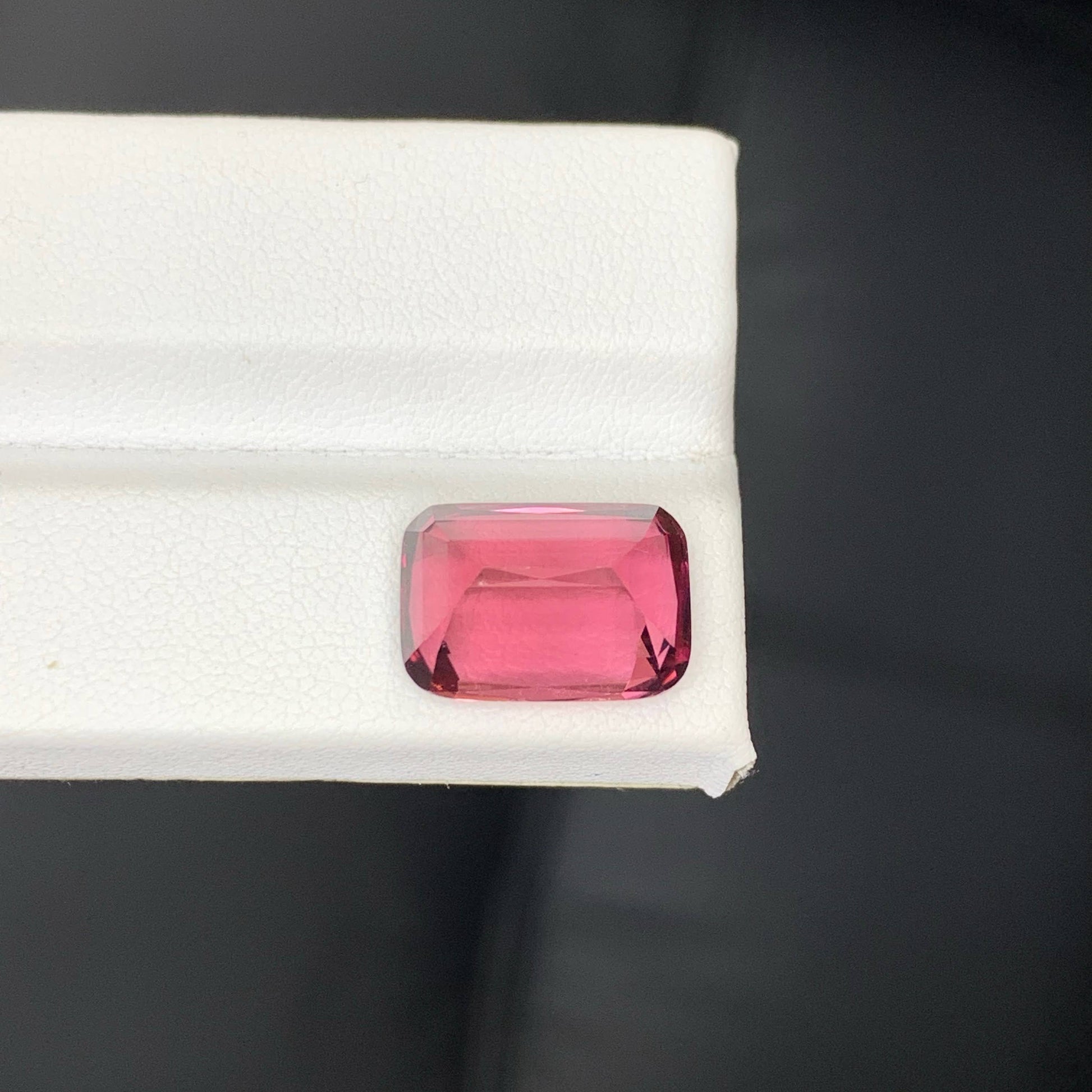 8.60 Carats Pink Tourmaline cushion cut pink gemstone on a white background