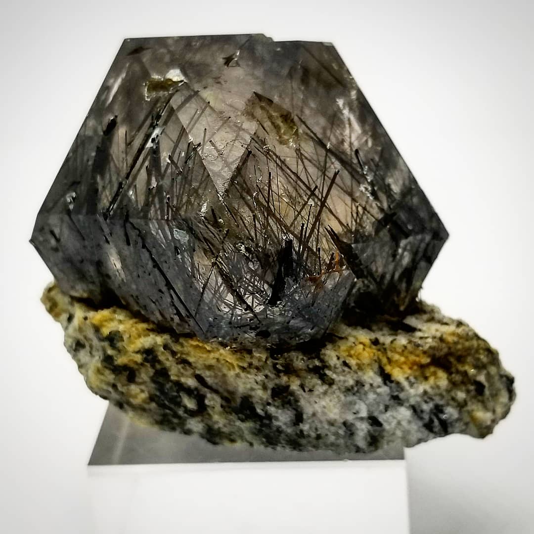 Crystal on a stand with a white background