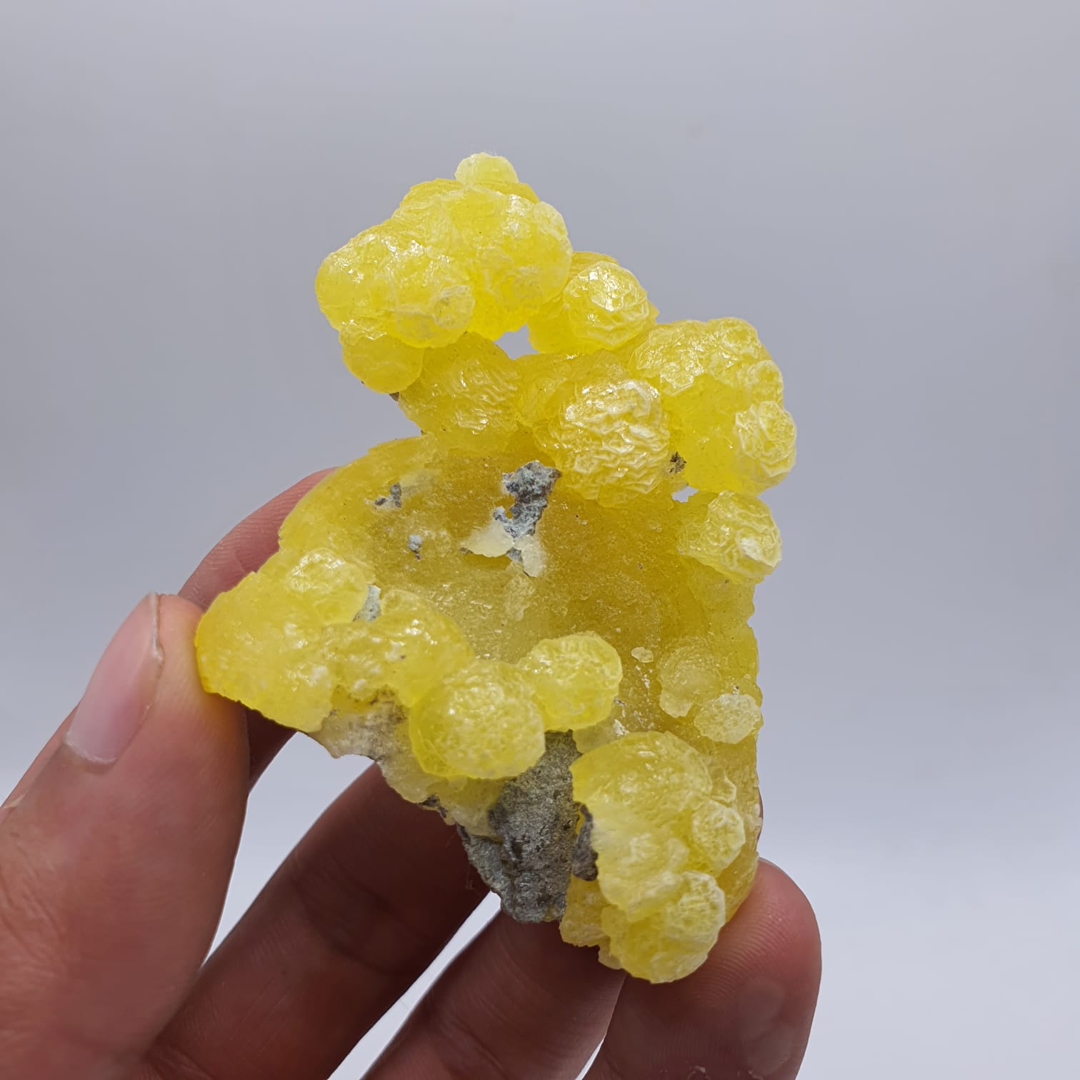 Lemon-Yellow Botryoidal Aggregate of Brucite with Detail Chromite Matrix