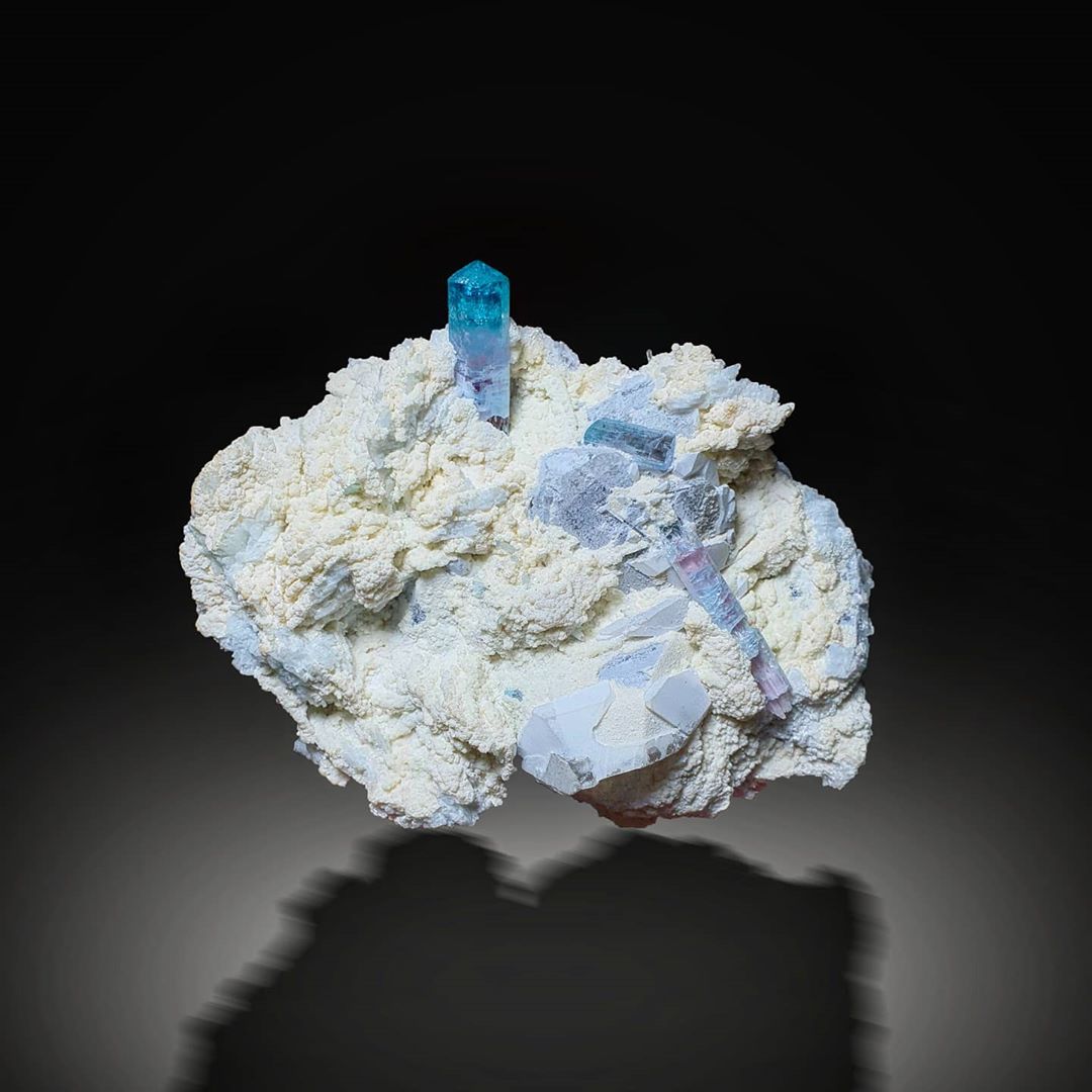 Multi-faced Gemmy Blue Tourmaline on a dark background at Gandhara Fine Minerals