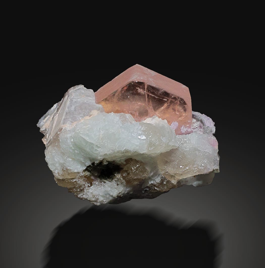 Pink Morganite Crystal with Lepidolite and Smokey Quartz on a dark background
