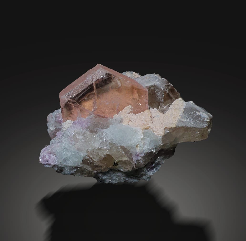 Pink Morganite Crystal with Lepidolite and Smokey Quartz on a dark background at Gandhara Fine Minerals