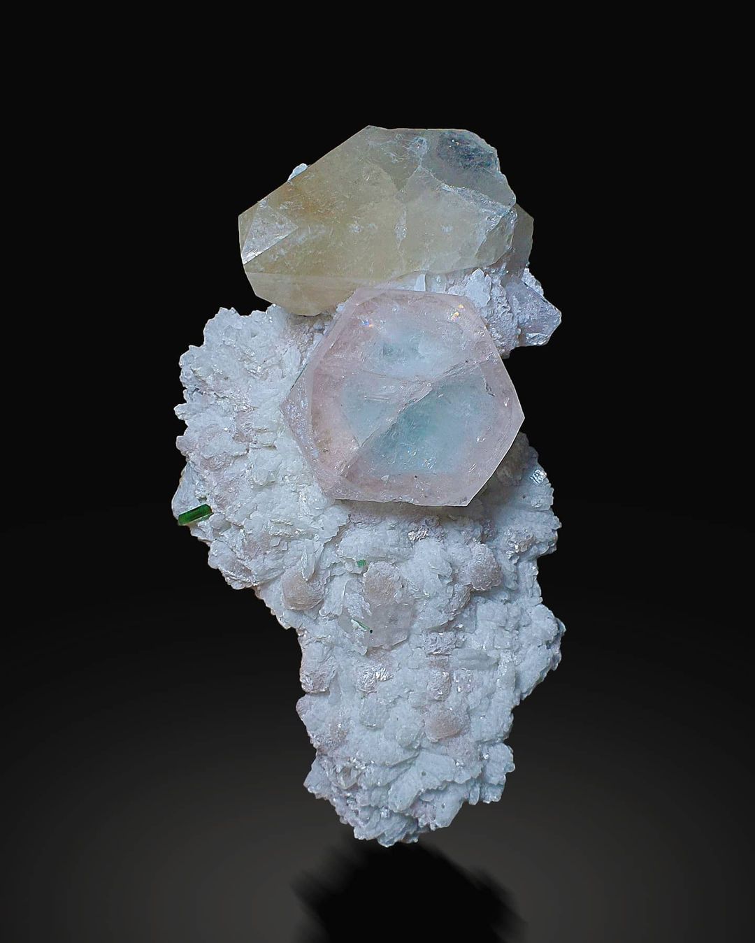 Morganite with Aqua Core Albite, Tourmaline and Smokey Quartz on black background at gandhara fine minerals