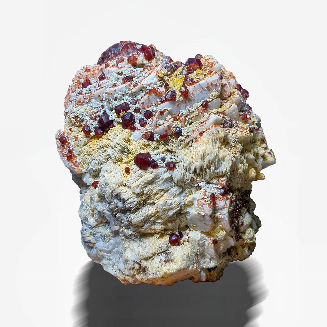 2,941 Grams Red Spessartine Garnet Crystals Spread on Albite