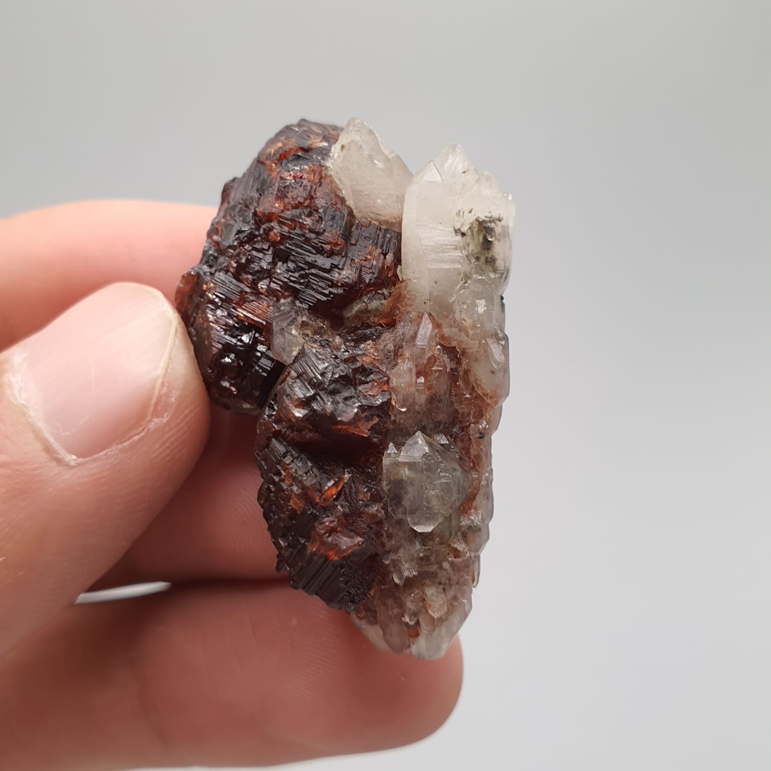 Red Spessartine Garnet Crystals On Quartz