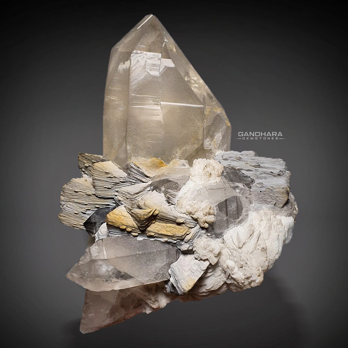 657 Grams Smokey Quartz Crystal on bladed Muscovite with Albite