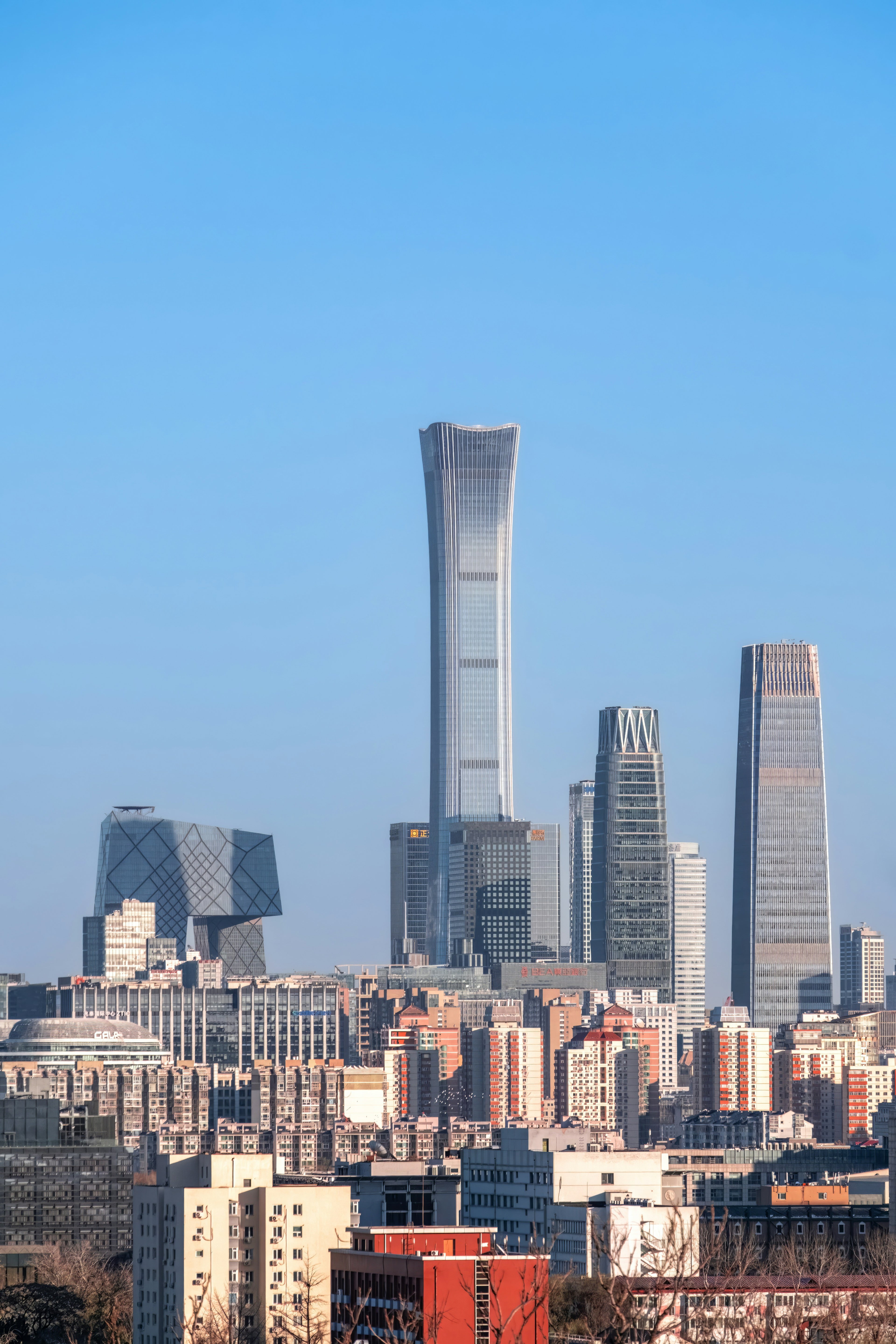 City skyline with modern skyscrapers against a clear blue sky