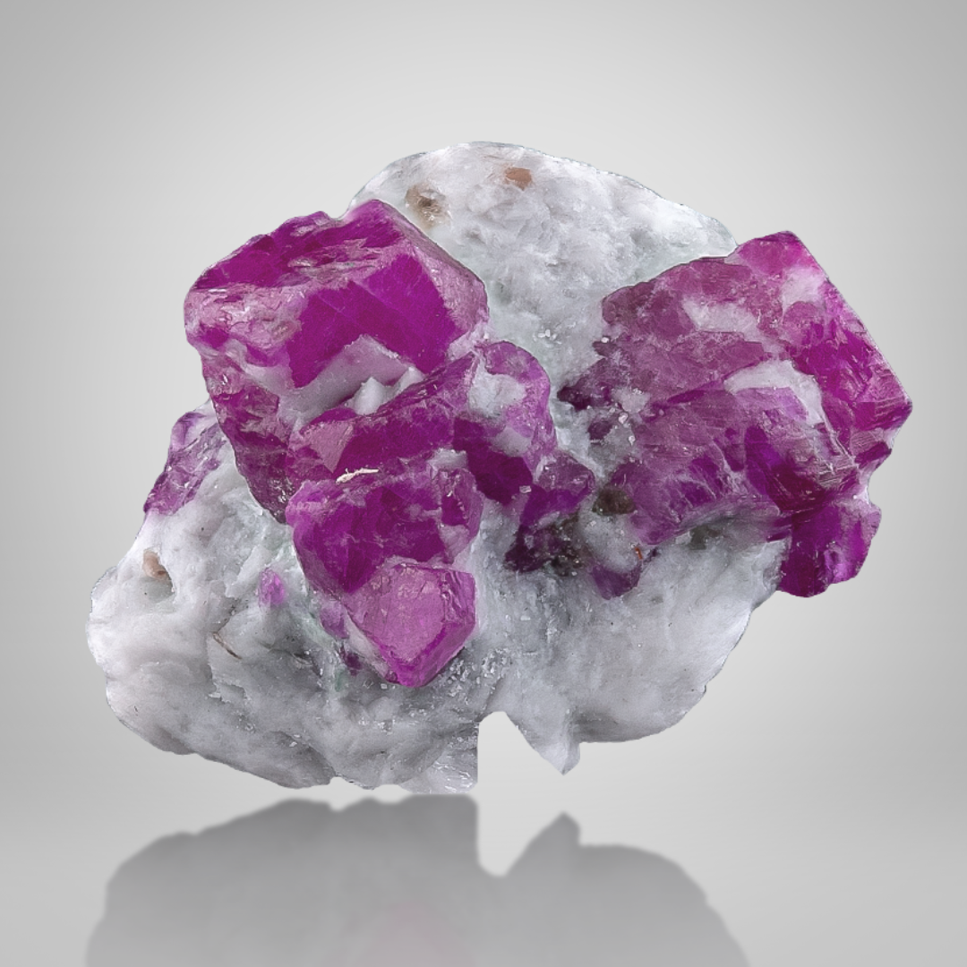 Red Ruby Crystals on Marble