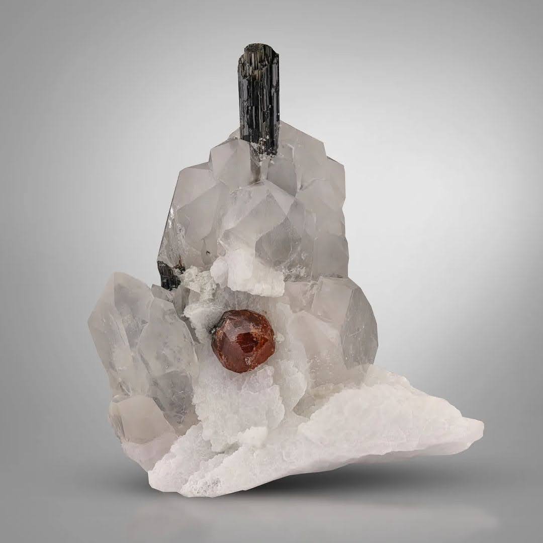 specimen of Hassonite Garnet on Quartz with Schorl from Pakistan