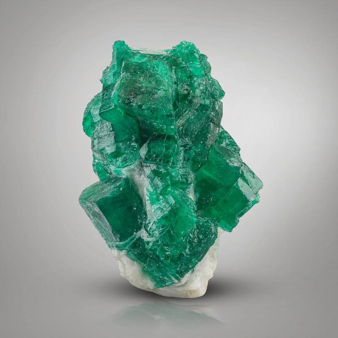Radiant Green Emerald Crystals Perched on Calcite Matrix from Pakistan