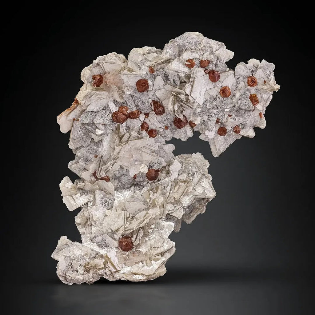 Specimen of Hassonite Garnet Crystals on Muscovite from Pakistan