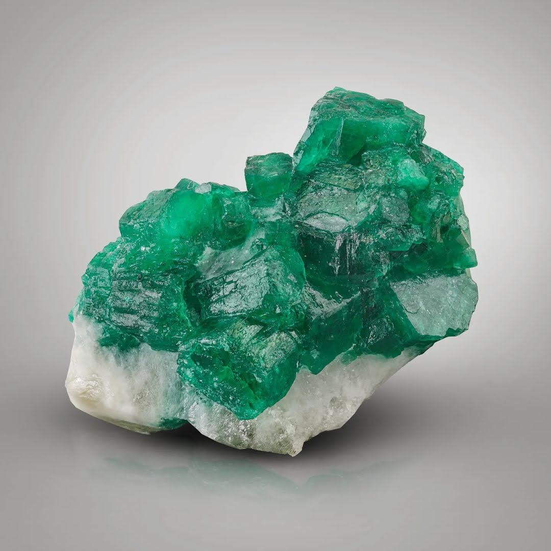 Radiant Green Emerald Crystals Perched on Calcite Matrix from Pakistan