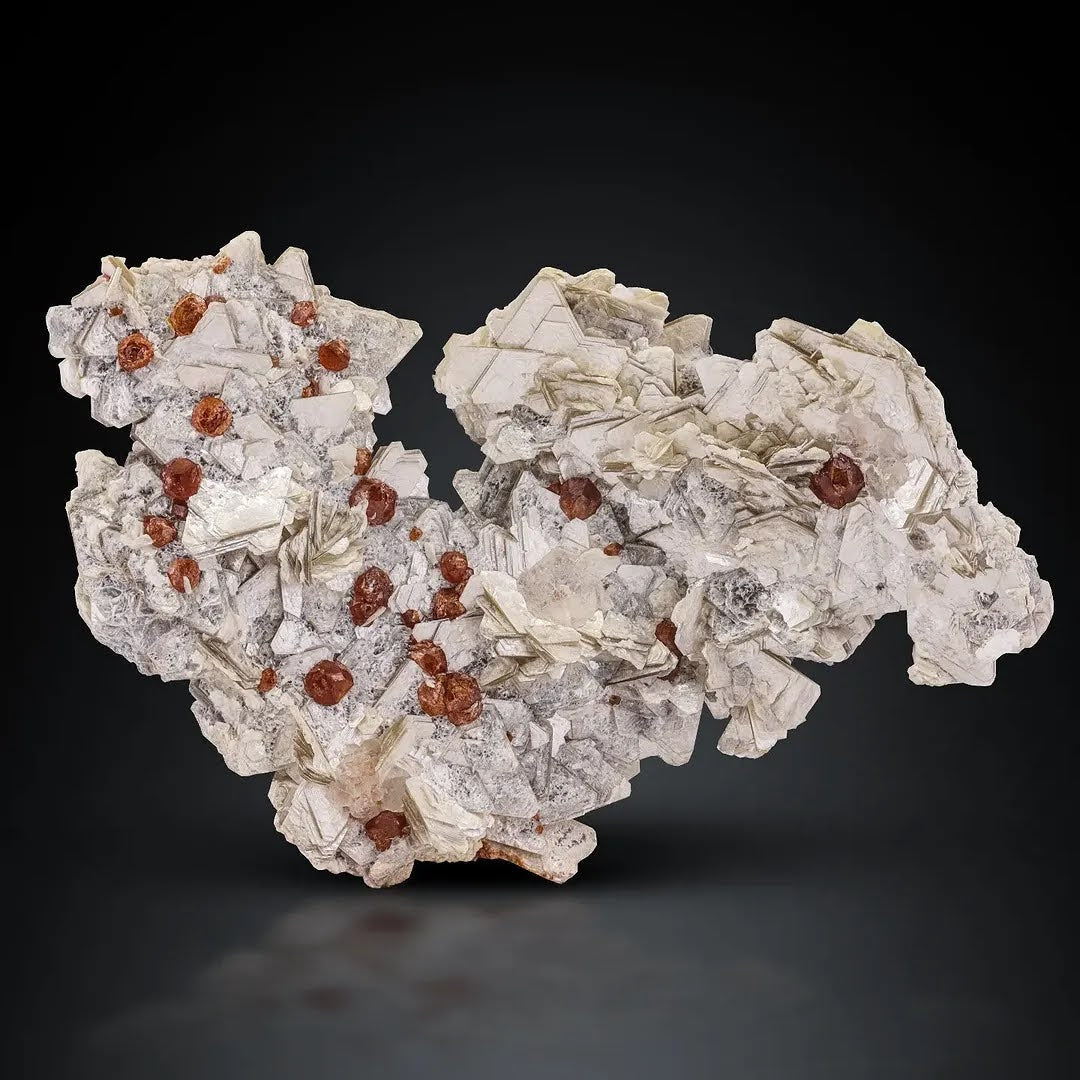Specimen of Hassonite Garnet Crystals on Muscovite from Pakistan