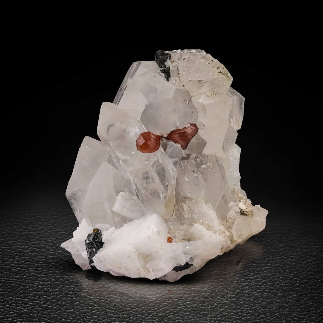 Red Hassonite Garnet crystals on Quartz with Schorl from Pakistan