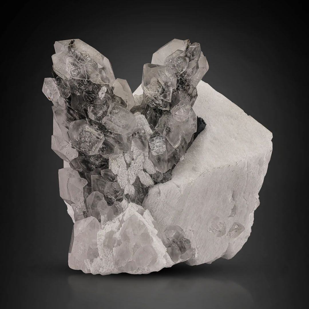 isolated double terminated Quartz on Feldspar with Garnet from Pakistan