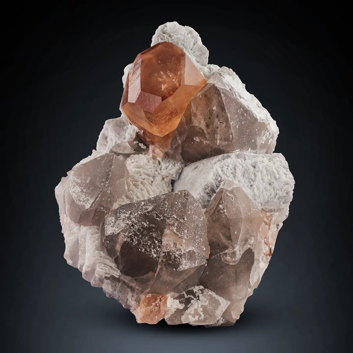 Glassy multi faced gem Champagne Topaz on Smoky Quartz from Pakistan