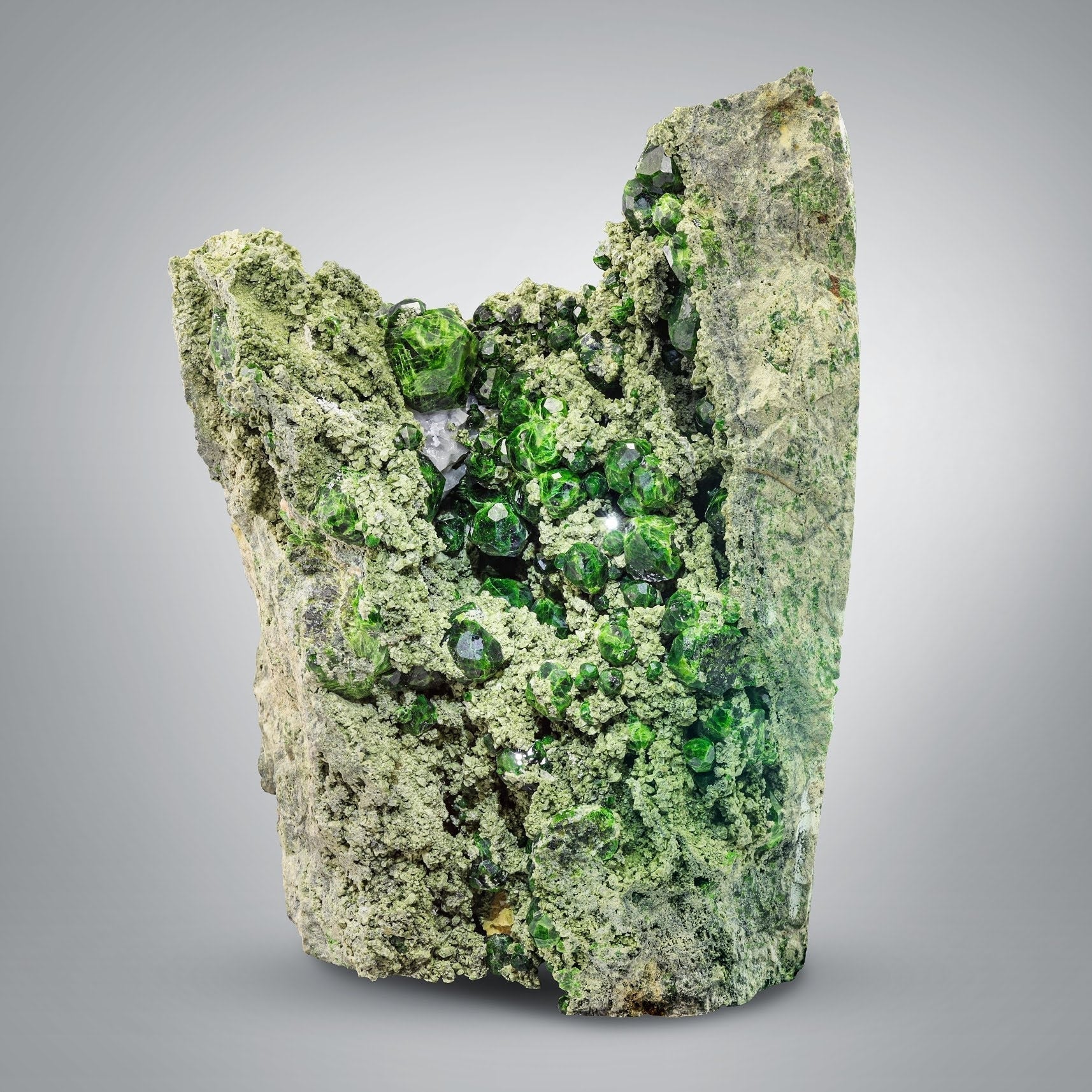 vibrant green Demantoid Garnet crystals on matrix from Iran