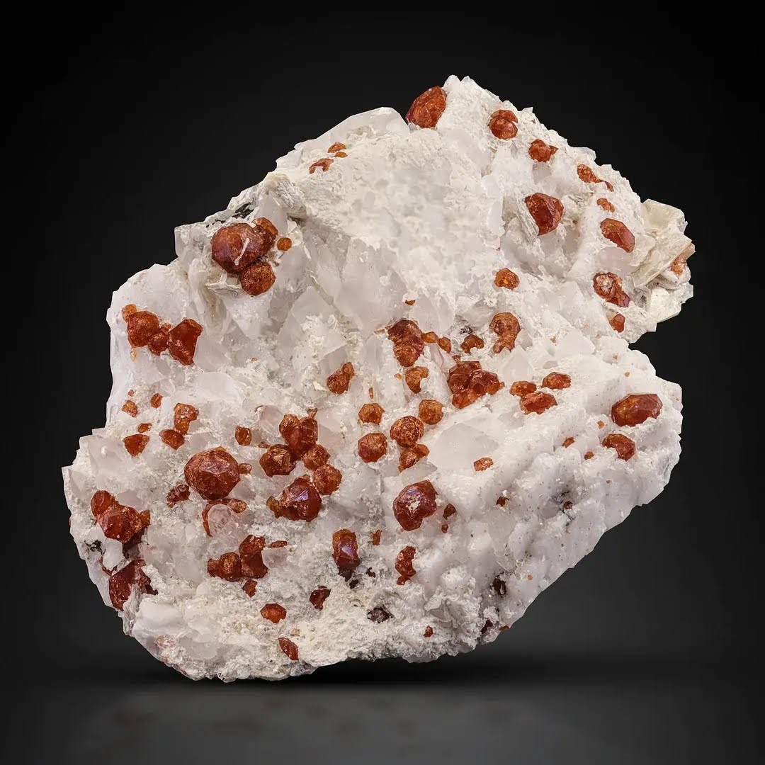 Red Hassonite Garnet crystals on White Albite from Pakistan