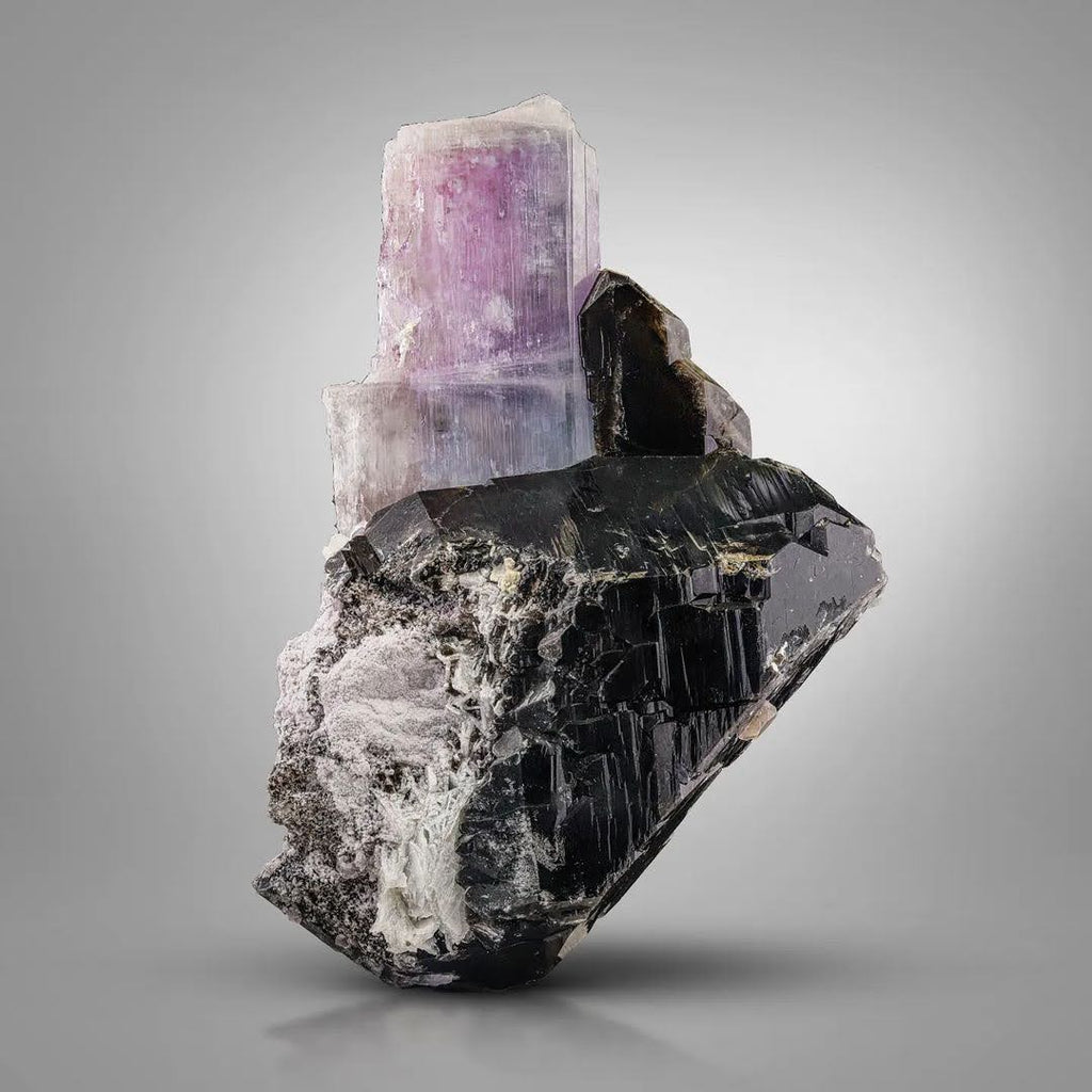 Pink Kunzite crystal nicely perched on Smoky Quartz from Afghanistan