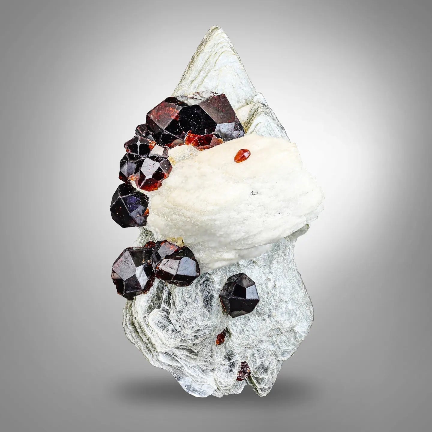Group of Spessertine Garnet Crystals on Albite Muscovite from Pakistan