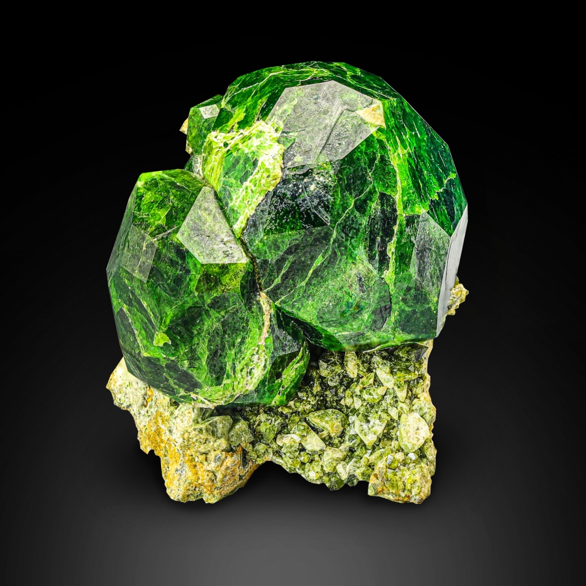 isolated and isometric Demantoid Green Garnet crystals on matrix from Iran
