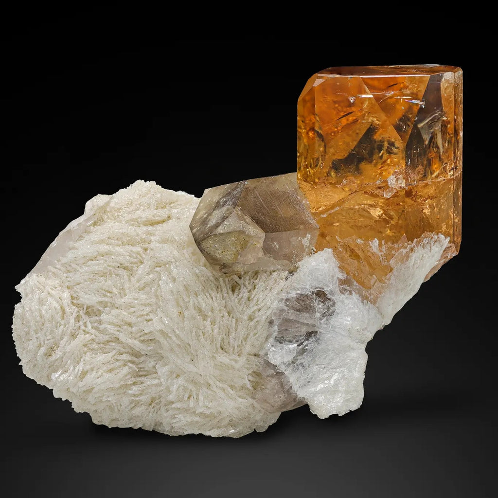 Saturated color Topaz on Cleavelandite with Smoky Quartz from Pakistan