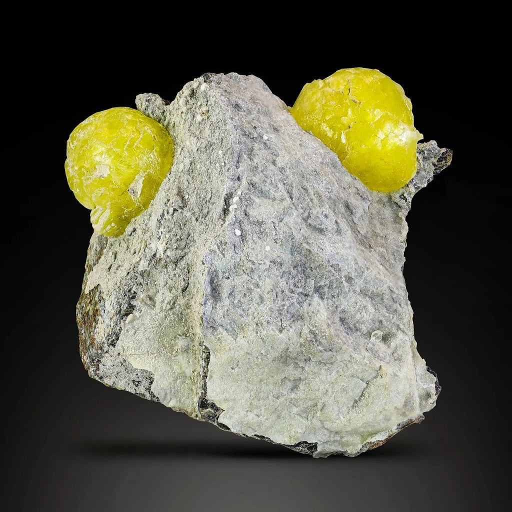 Isolated rounded Brucite crystals on Chromite matrix from Pakistan