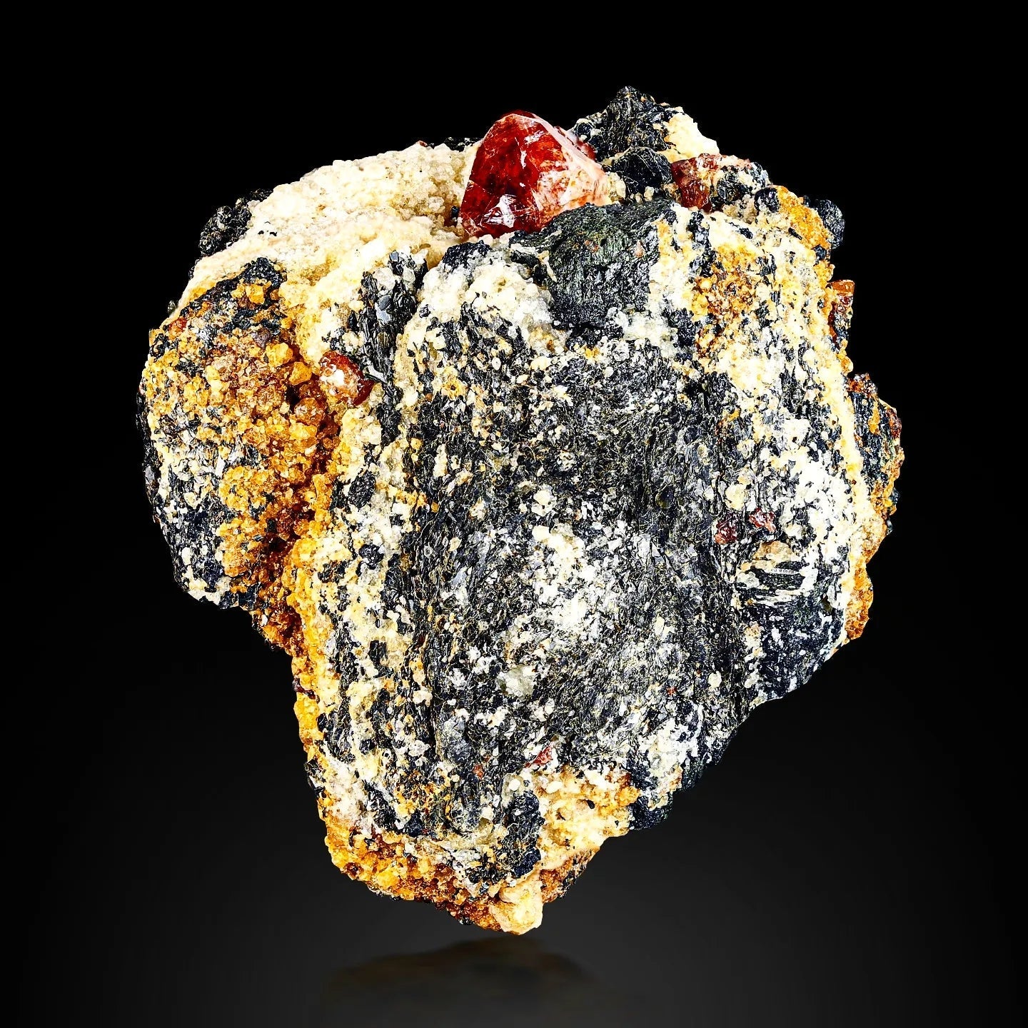 Vibrant Red Twinned Zircon crystals on Graphite matrix from Skardu, Pakistan